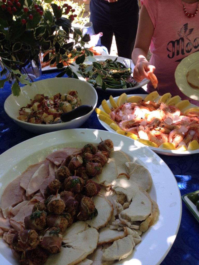 Gluten-free Christmas lunch meat, seafood and salads on platters