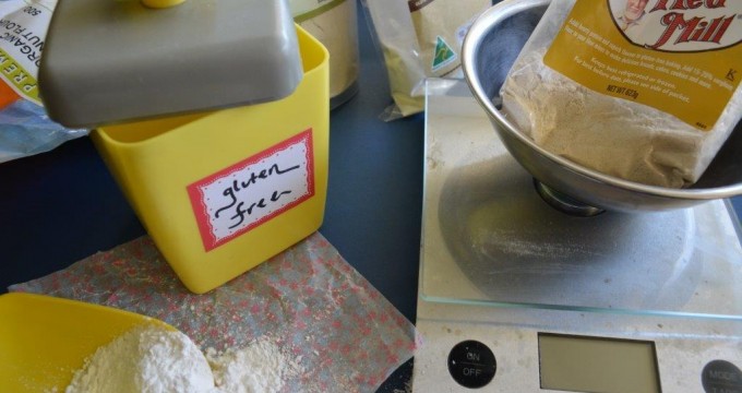 Yellow bakelite gluten-free flour canister with digital scales and Bob's Red Mill flour in foreground