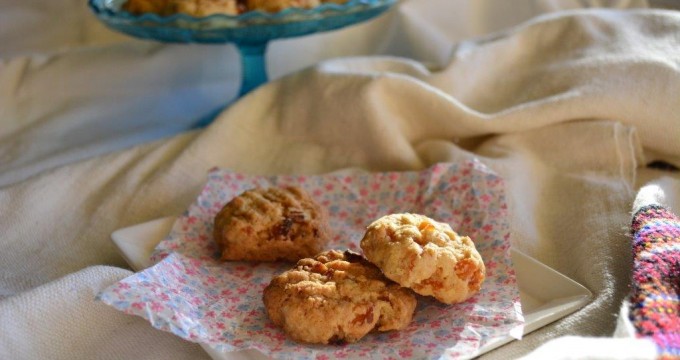 Gluten-free apricot and coconut cookies with blue cake stand in background