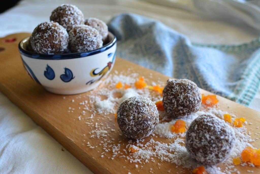 Gluten-free chocolate apricot balls in a patterned bowl